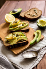 making sandwiches with avocado healthy organic food top view