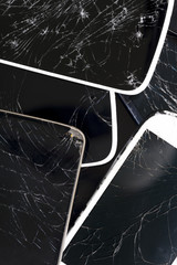 Shattered smartphones piled up