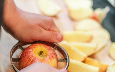 Cutting fresh red apples with the speacilised tool