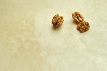 walnuts on beige pearl background