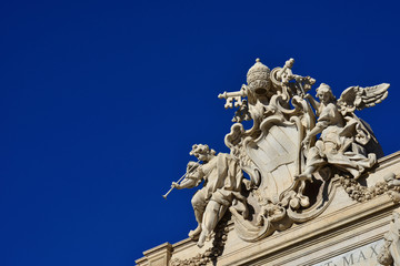 Obraz premium Pope Clement XII coat of arms. at the top of Trevi Fountain (with copy space)