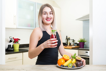 young blonde girl woman smile drink fresh fruit vegetable juice kitchen diet beauty 