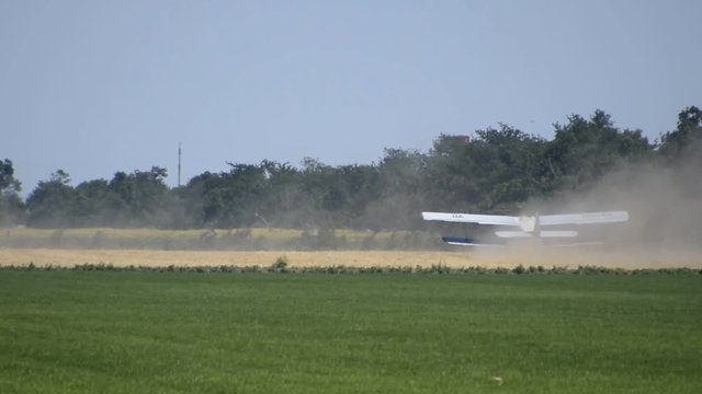 Aircraft agricultural aviation AN-2. The spraying of fertilizers and pesticides on the field with the aircraft.