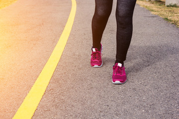 Woman running on the road.