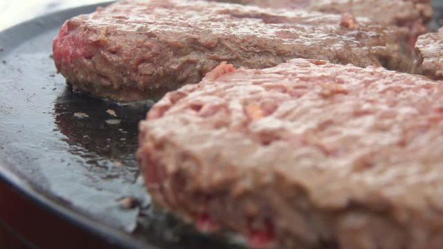 Pack of tasty burgers fried on the grill