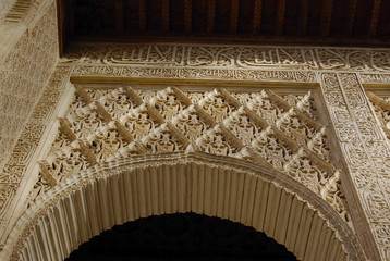 Fine decorations on the walls of Alhambra palace.