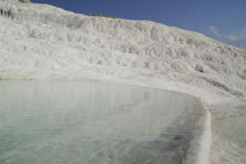 Fototapeta premium The calcium carbonate terraced water pools of Pamukkale, the 
