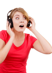 Woman in big headphones listening music isolated