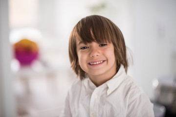 Cute adorable little boy in the kitchen