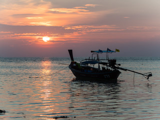 Longtail boat in the sunrise on Koh Lipe