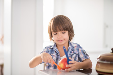 Cute adorable little boy in the kitchen