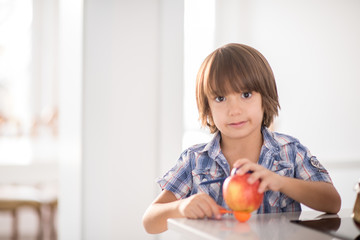 Cute adorable little boy in the kitchen