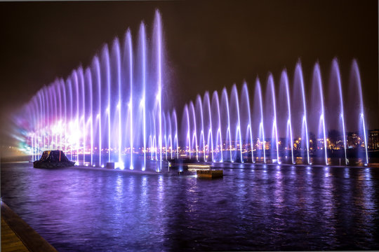 Fountains light art at night during the Amsterdam Light Festival.