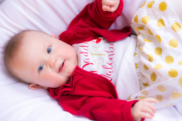 Happy baby girl wearing her first Valentine's Day outfit
