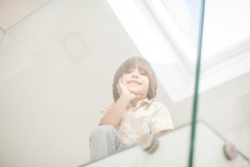 Fototapeta premium Cheerful kid at his room in new house