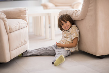 Happy children having fun and posing in new modern home