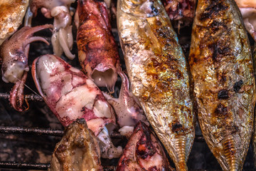 beside the street a small restaurant bbq sea food and pork for sale to tourist