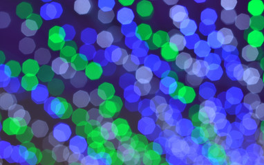 abstract blurred of blue purple green and silver lights background or blur light of Christmas decorations concept