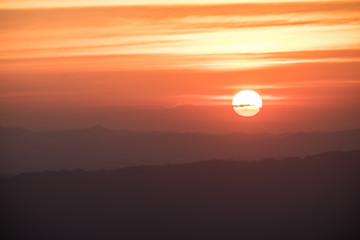 Dramatic sunset and sunrise over mountain morning evening sky.