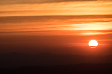 Dramatic sunset and sunrise over mountain morning evening sky.