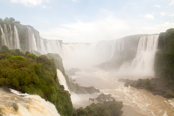 Iguazu (Iguacu) falls, largest series of waterfalls on the planet, located between Brazil, Argentina, and Paraguay with up to 275 separate waterfalls cascading along 2,700 meters (1.6 miles) cliffs.