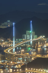 Fototapeta na wymiar Cargo port and bridge in Hong Kong city