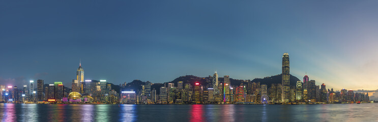 Fototapeta premium Panorama of Victoria Harbor in Hong Kong city at dusk