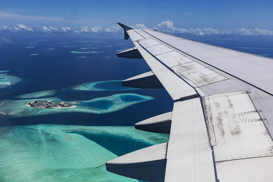 Arplane fly over Atolls at Indian ocean