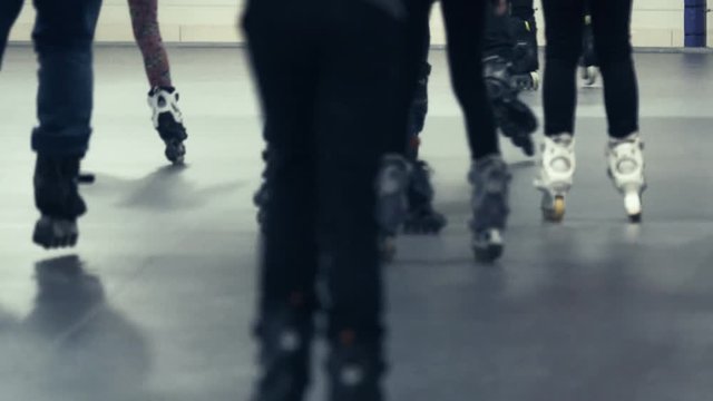 Crowd of teenagers on roller skates on rollerdrome