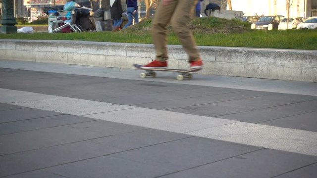 Young boy skating in the city in slow motion