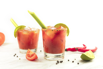 Bloody Mary cocktails with celery and lime - Powered by Adobe