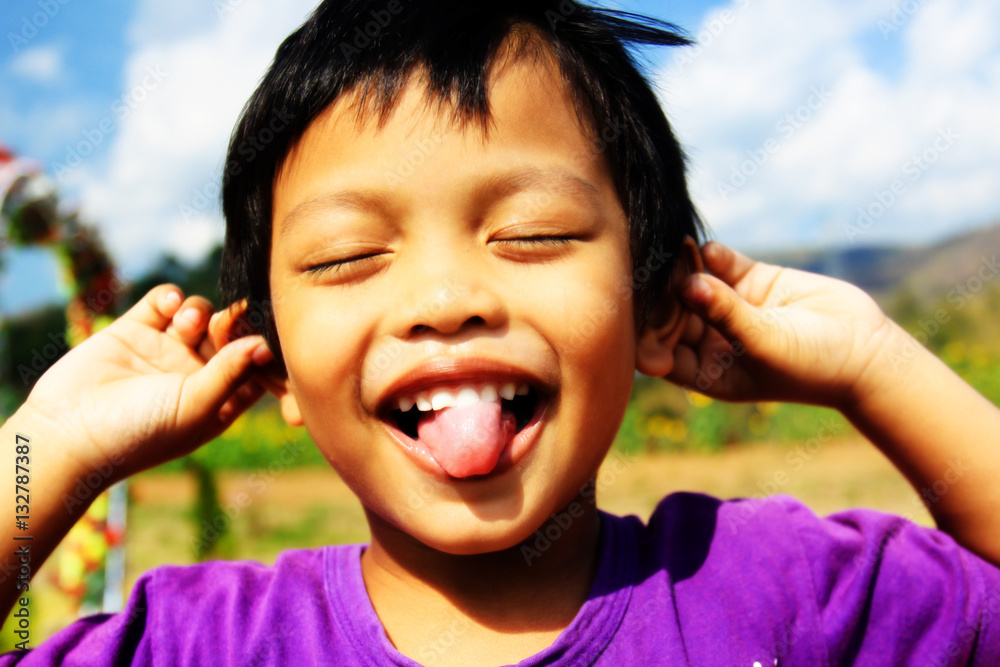 Wall mural Close happy portrait of a boy smiling