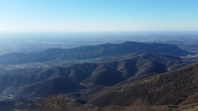 Great landscape with fantastic blue sky on the Orobie Alps and Padana plain a dry winter season without snow. Panorama from Linzone Mountain, Bergamo, Italy. 