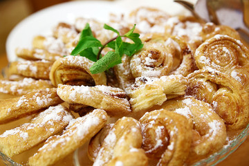 fresh cinnamon rolls sprinkled with vanilla