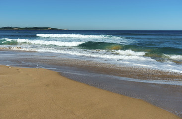 Fototapeta na wymiar Cronulla Beach Sydney surfers foam waves.