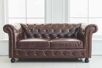 Beautiful vintage in interior, leather sofa next to wall with , concept of decoration retro-style illustration