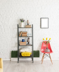 brick wall background bookshelf and red chair decoration
