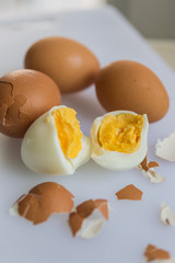 two halves of a boiled egg on white background