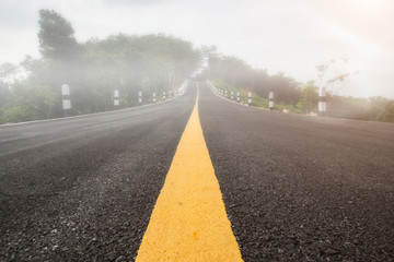 One yellow traffic line on the empty road.
