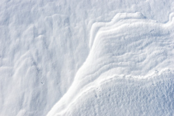 Close up of windy snow surface texture, winter background