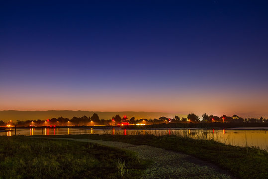 A Path At Night Overlooking The San Francisco Bay Wetlands.  Palo Alto Airport Lights At Night.