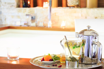Chamomile tea with teapot near jacuzzi. Valentines background. R