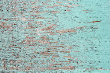 Ancient wood with cracked paint of blue color