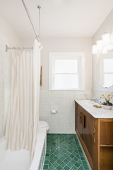 Bathroom with green tiles in white