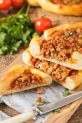 Turkish pide pizza with meat and cheese.