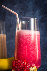 Fresh smoothie of banana, kiwi and pomegranate