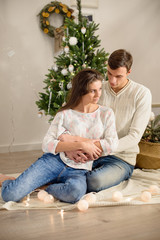 Beautiful young couple in love at Christmas
