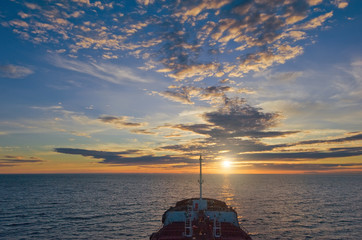 The bow of the small tanker at sunset.