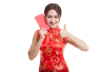 Asian girl in chinese cheongsam dress thumbs up with red envelop