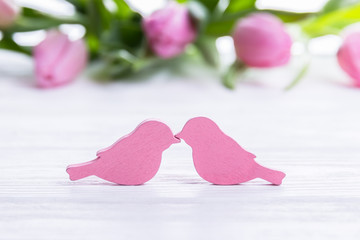 Happy Valentine's Day. Two birds and pink tulips.